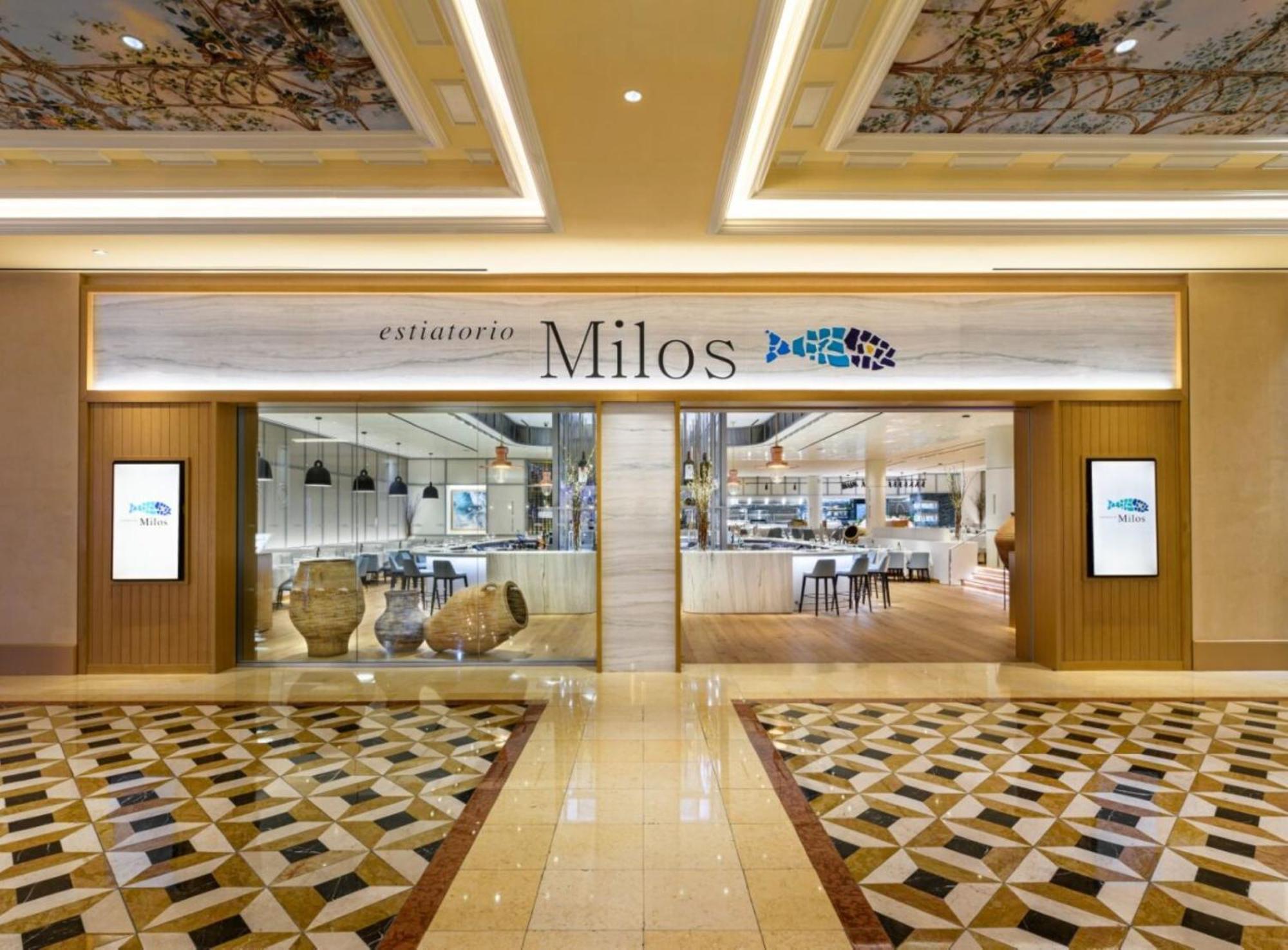 The Palazzo At The Venetian Hotel Las Vegas Exterior photo The image shows the entrance to a restaurant named "Milos." The exterior features a modern and elegant design, with a prominent sign displaying the restaurant's name. There are two large digital screens on either side of the entrance. The floor is de